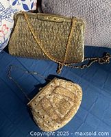 Both handbags together to show lot contents and size comparison