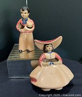 Front view of both ceramic figural vases