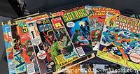 All ten comics fanned out showing titles and cover art