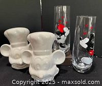 Full lot overview showing both ceramic shakers and both glass tumblers