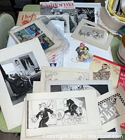 Overview of assorted ephemera spread on table