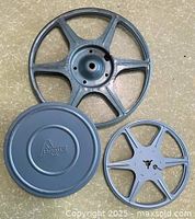 Large reel, one canister lid, one small reel