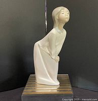 Full view of figurine on display stand