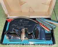 Open Dexter box showing chrome mat cutter and blade packs