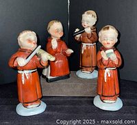 All four Chase monk figurines together