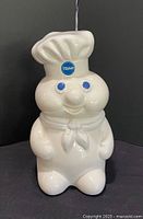 Front view of Pillsbury Doughboy ceramic bank