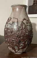 Full view of ovoid stoneware vase showing overall form and glazing