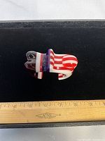 Top view of resin cuff showing colour pattern and width next to ruler