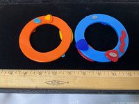 Top view of both bangles with ruler for scale