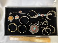 Full tray showing all jewellery pieces with ruler for scale