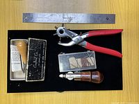 Overview of rotary punch, ruler, boxed tools, groover, awl