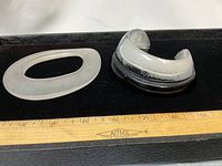 Top view of both resin bracelets showing shapes and colour contrast