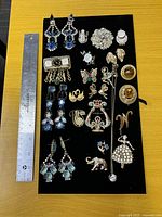 Full lot on display board with ruler for scale