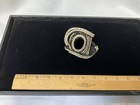 Top view of cuff showing rhinestone layout and ruler for scale