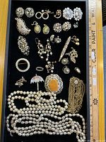 Full tray showing all jewellery pieces with ruler for scale