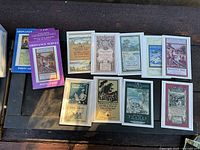 Two Ordnance Survey postcard packs and eleven loose postcards displayed