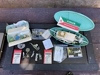 Overview of Singer buttonholer case, template boxes, presser feet and accessories