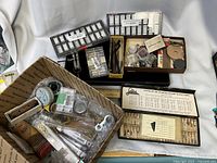 Overview showing Lomat set, two trays of watch parts, USPS box of loose tools and components