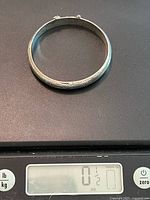 Top view of entire bangle on scale showing weight