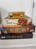 Stacked view of all four game boxes