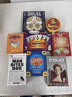 All eight boxed games arranged on table