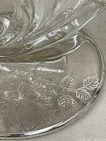 Base of candlestick with engraved floral metal overlay