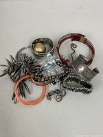 Pile of assorted bracelets laid out on table