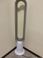Full view of Dyson Cool tower fan showing entire height and loop amplifier