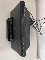 Front angled view of Sony docking clock radio showing 30-pin cradle and control buttons