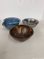 All three clay mixing bowls grouped together
