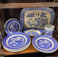 Group shot of platter, plates, bowls and jar