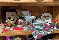 Shelf with assorted Christmas decorations overview