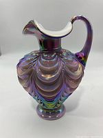 Full view of vase front showing draped pattern and handle