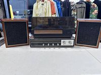 Front view of receiver, turntable on top, and both speakers