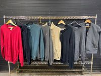 Full rack view showing all eight tops