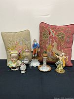 Group shot showing all figurines and pillows