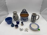 group shot of all thirteen blue and white ceramic items