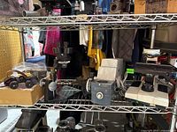 shelving showing compound microscope, loose microscope components