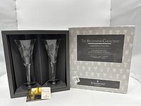 Pair of Waterford Millennium toasting flutes in presentation box alongside outer sleeve