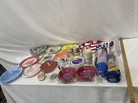 overall view showing all assorted plates, bowls, cups, platter, picks