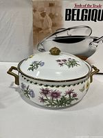 Regency Club Dutch oven with floral lid and gold accents
