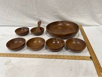 Complete 8-piece teak salad set with rulers for scale