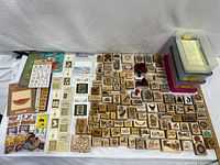 Overhead view of entire lot showing rubber stamps, stencils, ink pads, booklets and storage bins