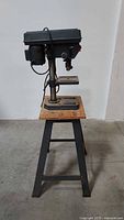 Front view of Craftsman drill press on metal stand