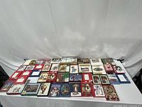 Overview of all boxed card sets laid out on table