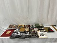 Overall view of 17 World War II books and boxed set on table