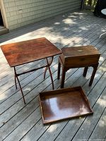 All three wooden items: folding table, writing slope on stand, serving tray