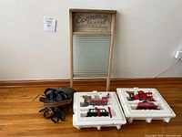Overall lot showing washboard, binoculars, trains in styrofoam