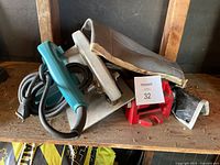 Makita circular saw, vise and folded tool roll