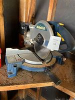 Left front view of Mastercraft compound miter saw showing blade, guard, fence and base